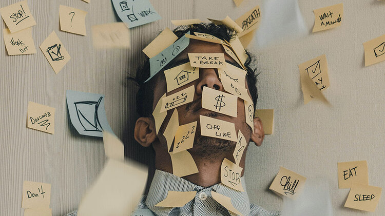a man covered in post it notes